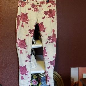 Burgundy floral large print skinny jeans.